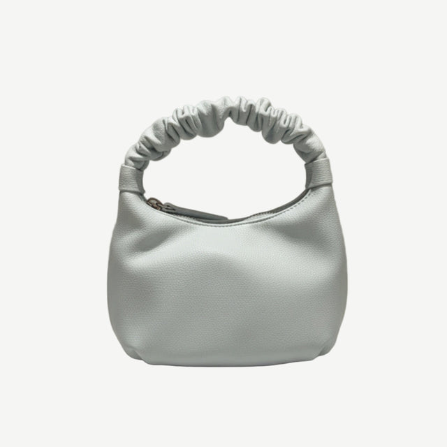 Bolso Mini Scrunch Blue en material vegano premium, con asa fruncida y diseño compacto. Ligero, flexible y moderno, ideal para looks diarios y casual chic.